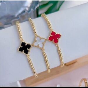 Elegant Gold and Red Clover Bracelet Set